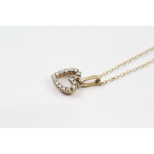 85 - 9ct gold diamond heart pendant & chain (1.9g)