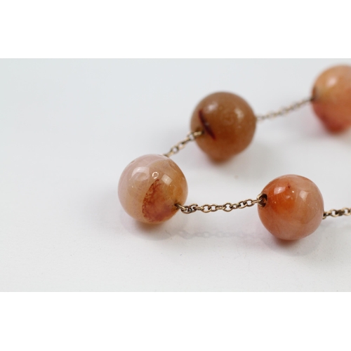 93 - 9ct gold agate bead necklace (27.1g)