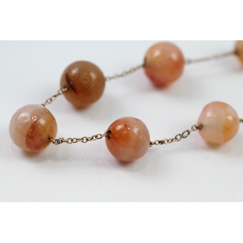 93 - 9ct gold agate bead necklace (27.1g)