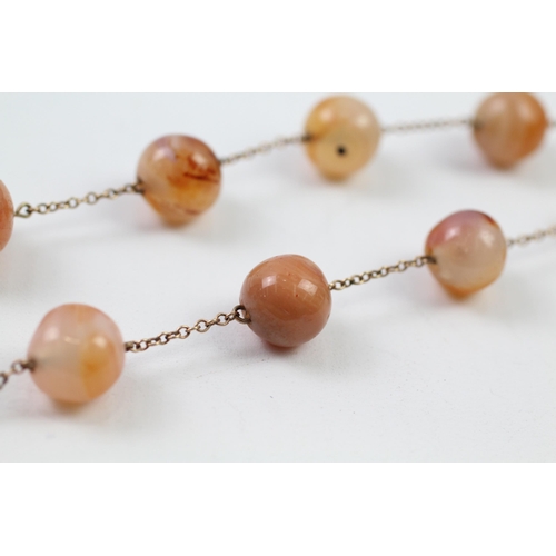 93 - 9ct gold agate bead necklace (27.1g)