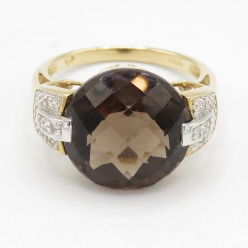 142 - 9ct gold faceted smokey quartz & diamond dress ring (5.1g) Size  O