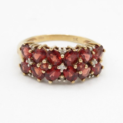 145 - 9ct gold garnet & diamond half eternity ring (2.8g) Size  P 1/2