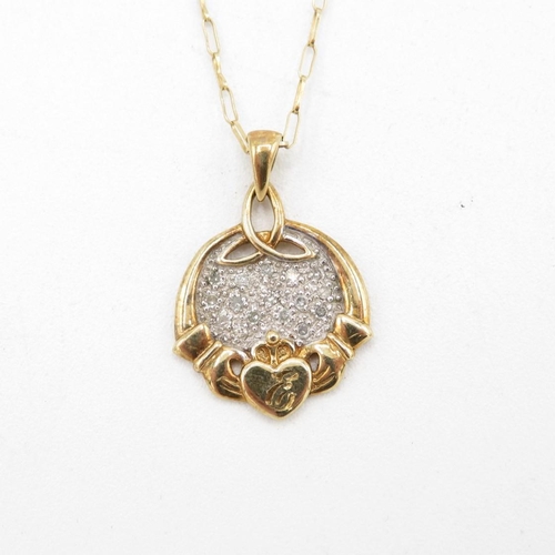 72 - 9ct gold diamond Claddagh pendant & chain (3g)