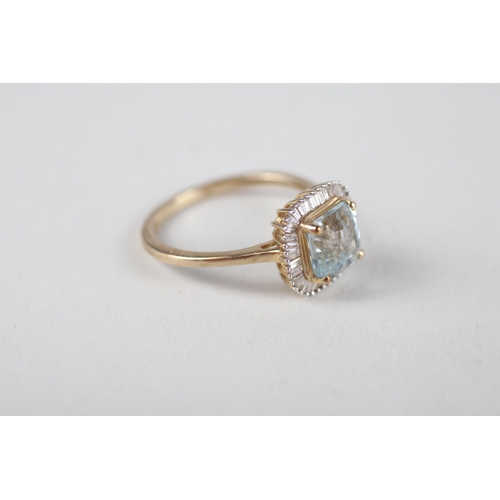 107 - 9ct gold aquamarine & diamond halo ring (2.3g) Size  O 1/2