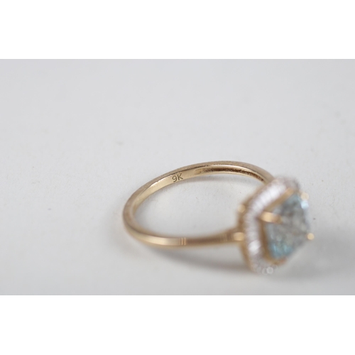 107 - 9ct gold aquamarine & diamond halo ring (2.3g) Size  O 1/2