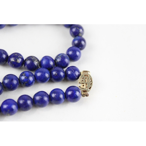 139 - 14ct gold lapis bead necklace (60.3g)