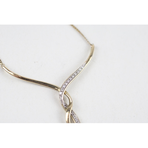 144 - 9ct gold diamond necklace (2.6g)