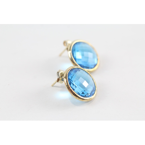 163 - 9ct gold faceted blue topaz earrings (7.1g)