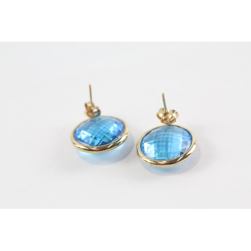 163 - 9ct gold faceted blue topaz earrings (7.1g)