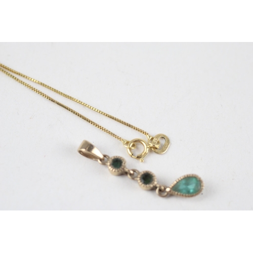 183 - 9ct gold blue topaz pendant & chain (1.7g)