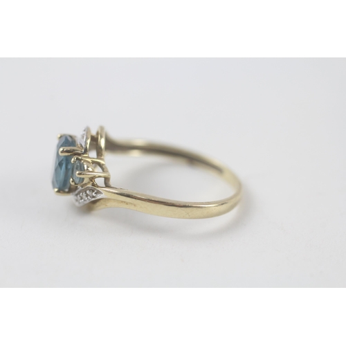 198 - 9ct gold blue topaz & diamond ring (2.3g) Size  R