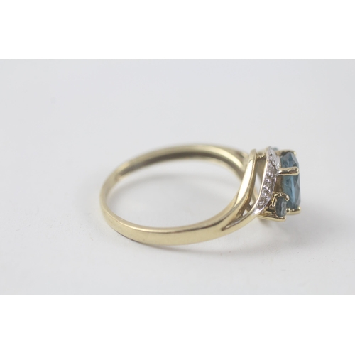 198 - 9ct gold blue topaz & diamond ring (2.3g) Size  R