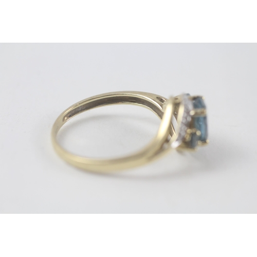 198 - 9ct gold blue topaz & diamond ring (2.3g) Size  R