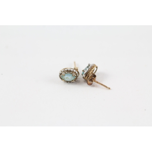 58 - 2 x 9ct gold diamond & topaz stud earrings (1.7g)