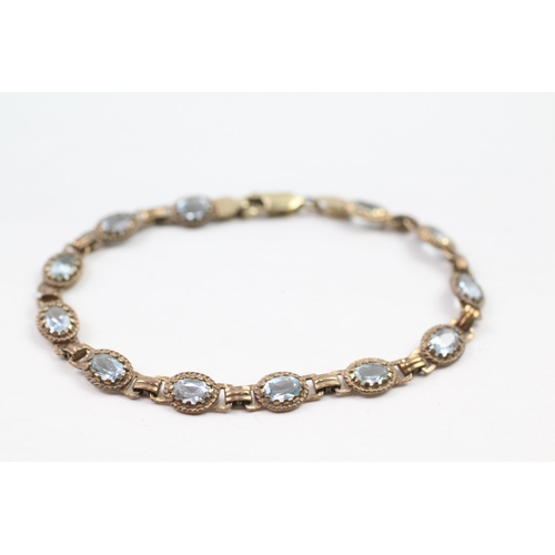 66 - 9ct gold blue topaz bracelet (7.5g)