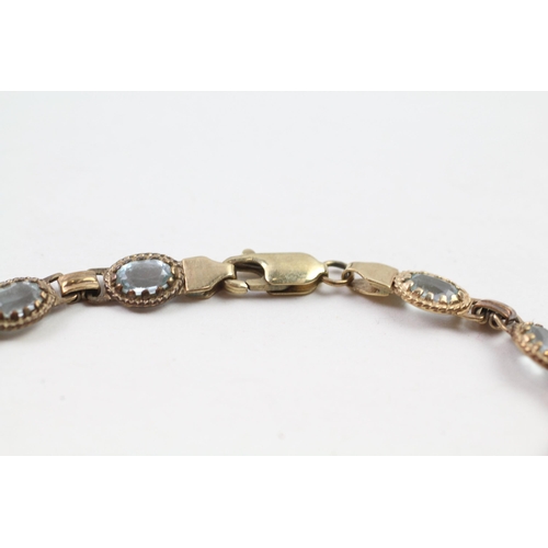 66 - 9ct gold blue topaz bracelet (7.5g)