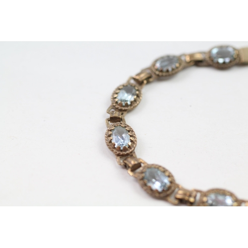 66 - 9ct gold blue topaz bracelet (7.5g)