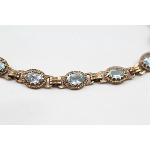 66 - 9ct gold blue topaz bracelet (7.5g)