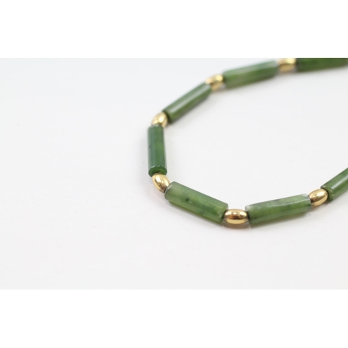 67 - 9ct gold nephrite bead necklace (9.8g)