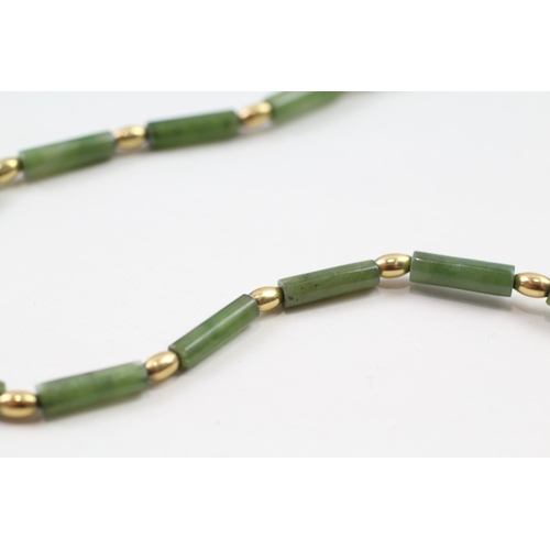 67 - 9ct gold nephrite bead necklace (9.8g)