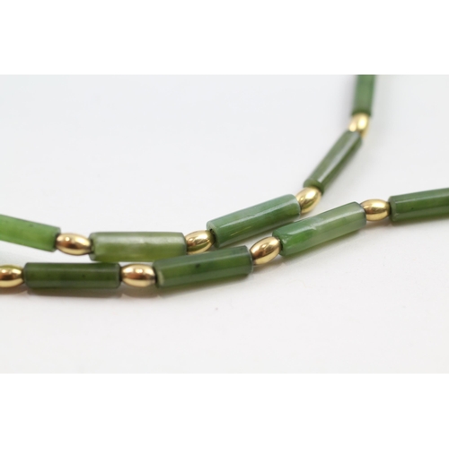 67 - 9ct gold nephrite bead necklace (9.8g)