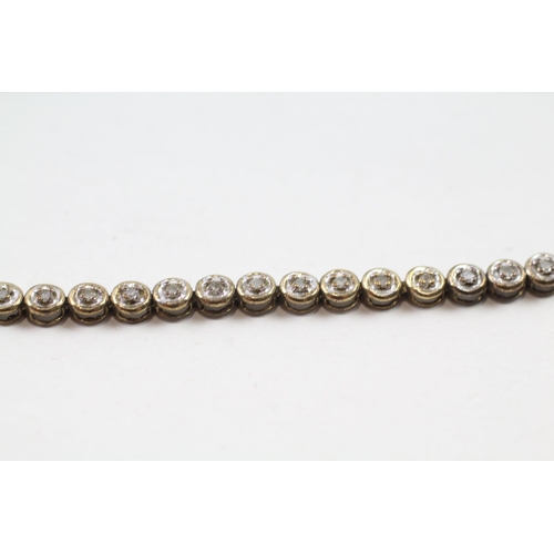 68 - 9ct gold diamond line bracelet (5.5g)