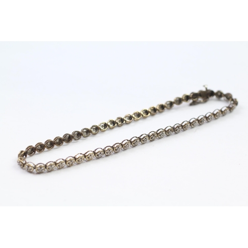 68 - 9ct gold diamond line bracelet (5.5g)