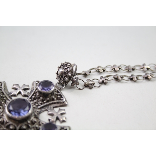 221 - Silver cross necklace set with synthetic colour change Sapphires (47g)