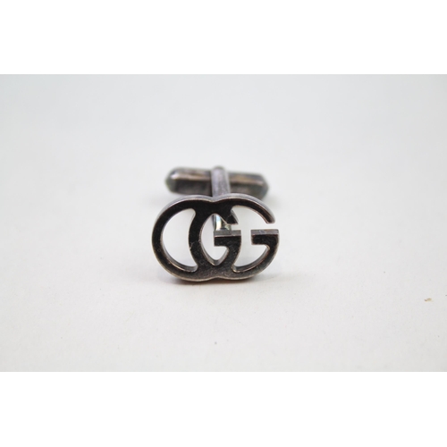 235 - Pair of silver cut work cufflinks by designer Gucci (10g)