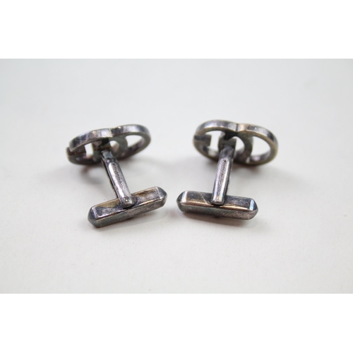 235 - Pair of silver cut work cufflinks by designer Gucci (10g)