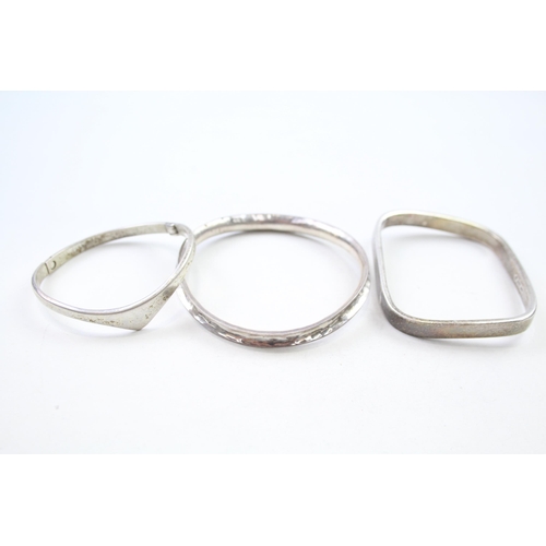 155 - Three silver modernist bangles (91g)