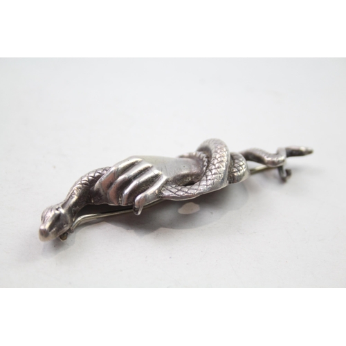 161 - Silver brooch depicting hand holding snake (16g)