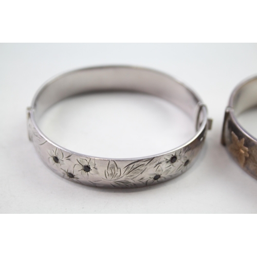 172 - Two silver bangles with gold accents and gemstone (61g)