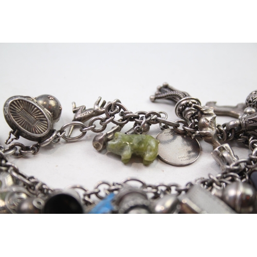 173 - Silver charm bracelet including coin charms (78g)