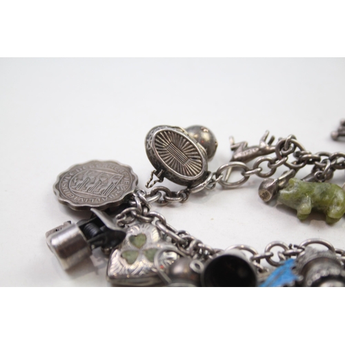 173 - Silver charm bracelet including coin charms (78g)