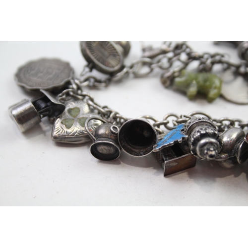 173 - Silver charm bracelet including coin charms (78g)