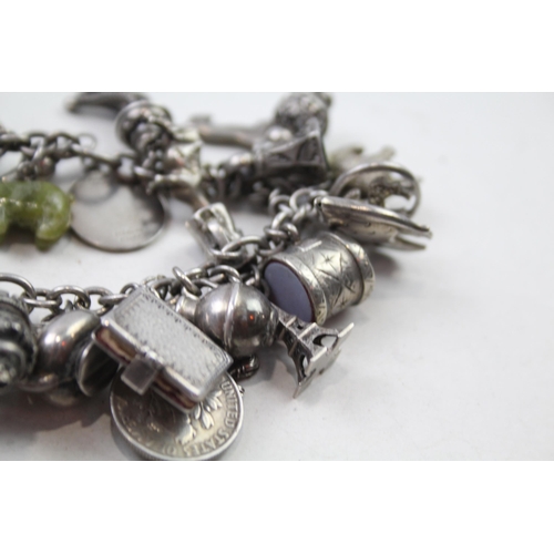 173 - Silver charm bracelet including coin charms (78g)