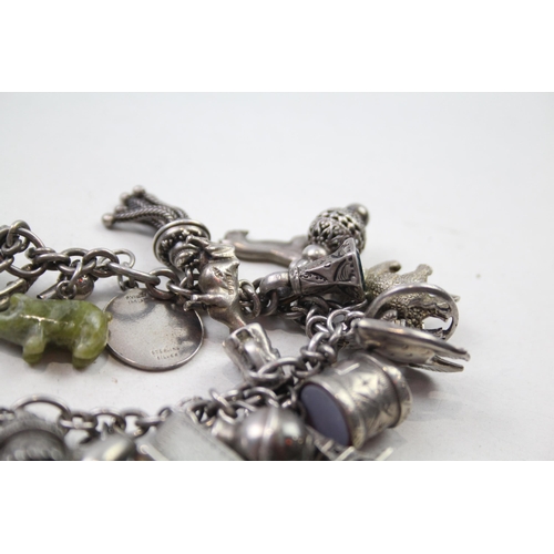 173 - Silver charm bracelet including coin charms (78g)