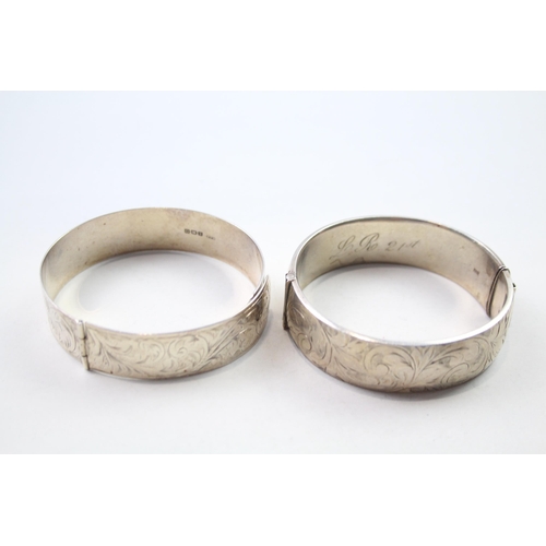 186 - Two silver bangles with etched designs (71g)