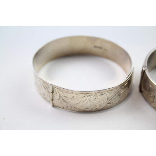 186 - Two silver bangles with etched designs (71g)