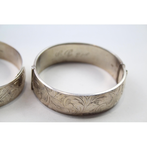 186 - Two silver bangles with etched designs (71g)