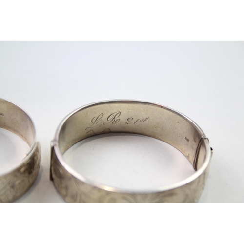 186 - Two silver bangles with etched designs (71g)