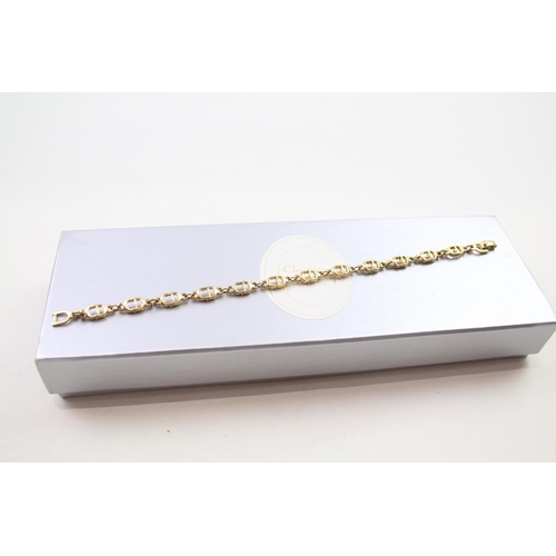 187 - Gold tone logo bracelet by designer Christian Dior in original box (6g)