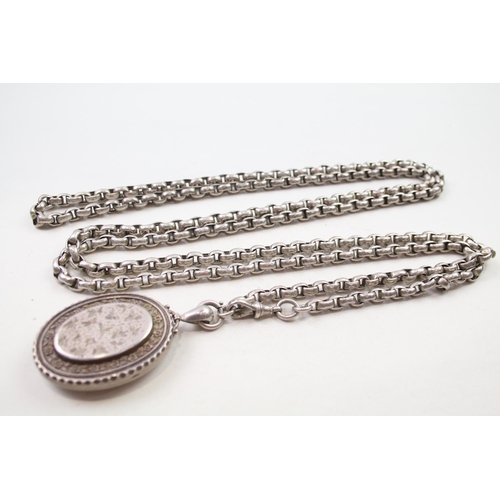 193 - Silver antique locket on long length chain (133g)