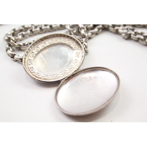 193 - Silver antique locket on long length chain (133g)