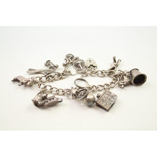 197 - Silver charm bracelet including animal charms (54g)