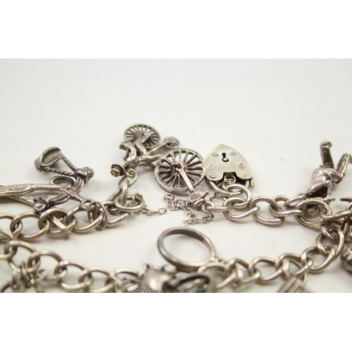 197 - Silver charm bracelet including animal charms (54g)