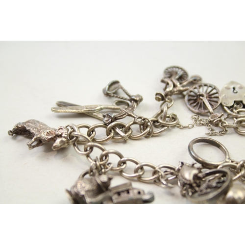 197 - Silver charm bracelet including animal charms (54g)