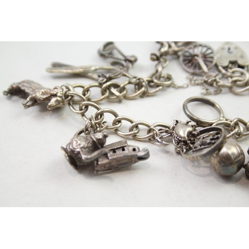 197 - Silver charm bracelet including animal charms (54g)