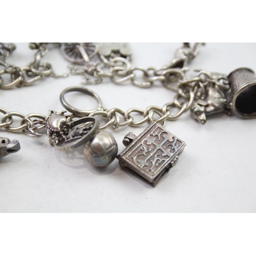 197 - Silver charm bracelet including animal charms (54g)